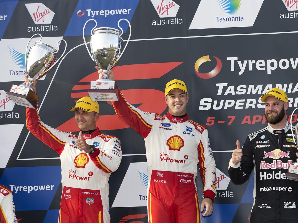 Scott McLaughlin of Team Shell V- Power Racing (centre)celebrates his win of race 7 with Fabian Coulthard (2nd) and Shane Van Gisbergen RHS (3rd) at Symmons Plains. PICTURE CHRIS KIDD