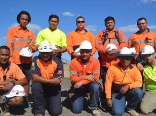 Kiwi construction contractors (back, from left) Wayne Faapito, Blake Kefu, Andrew Manu, Armine Kay, Ralph Williams, (front, from left) Tee Kefu, Mafi Kefu, Matthew Hapeta and Rob Leilua helped to lift a car off a man near Yuleba. They are pictured with fellow worker Ardelius Mitchell (front, far right). Picture: Contributed