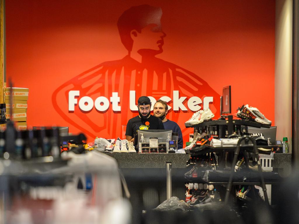 Retail staff in Foot Locker in the Bourke St Mall getting ready to open this week. Picture: Jay Town