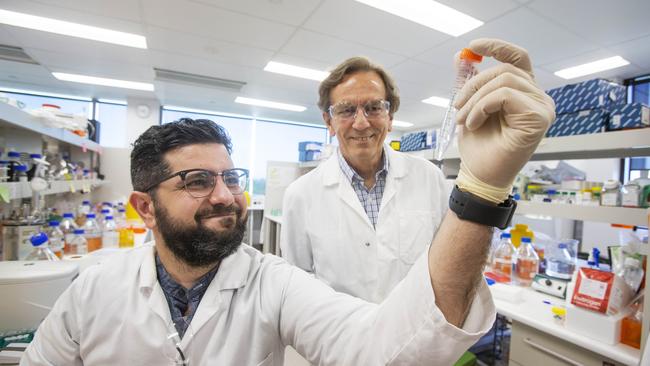 Dr Harry Al-Wassiti, left, with Professor Colin Pouton in the lab at Monash University's institute of Pharmaceutical sciences where they are making an mRNA vaccine against COVID-19. Picture: Aaron Francis