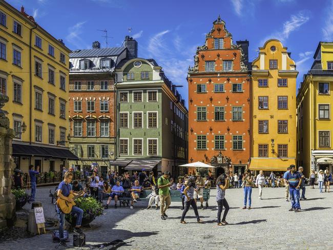 Stockholm, Sweden : Crowds of tourists and locals enjoying the summer sunshine beneath the colourful townhouses and quaint restaurants of historic Stortorget, Great Square, the iconic landmark plaza on Gamla Stan in the heart of Stockholm, Sweden's vibrant capital city. Photo - istockEscape 5 Aug 2023Why I Travel