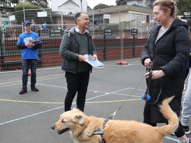 Victorian Liberal Party Leader John Pesutto (centre) at a voting booth in the Warrandyte by-election. Picture: NCA NewsWire / David Crosling