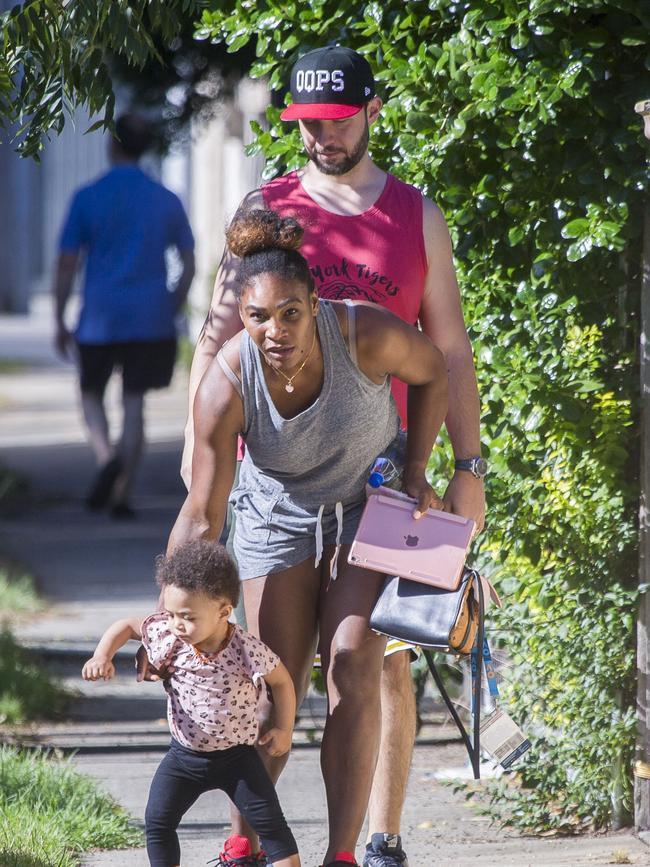 Serena Williams and her husband Alexis Ohanian enjoy an afternoon walk with their 1-year-old daughter Alexia Olympia. Serena's daughter looked seriously cute, toddling her way down the footpath, wearing Nike sneakers like her Mummy. Picture: MediaMode