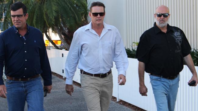 Former NT Police senior sergeant Neil Mellon (centre) arrives at court with supporters on Tuesday. Picture: Jason Walls