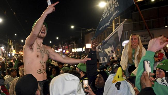 Philadelphia Eagles fans celebrate in Philadelphia after the team defeated the Washington Commanders in the NFC Championship NFL football game Sunday, Jan 26, 2025. (Tom Gralish/The Philadelphia Inquirer via AP)