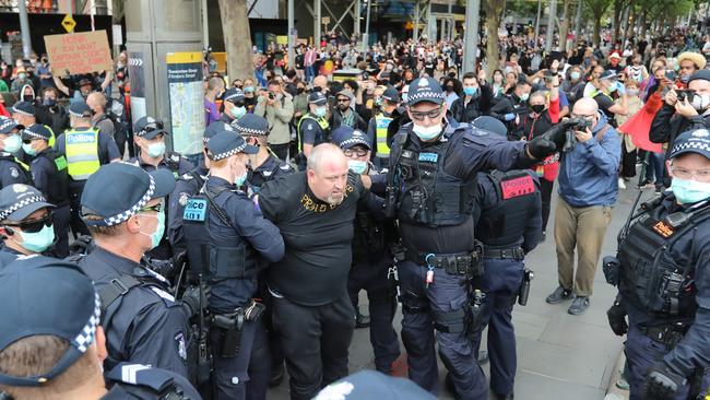 A man from another protest is arrested amid Melbourne’s Invasion Day rally. Picture: Alex Coppel.