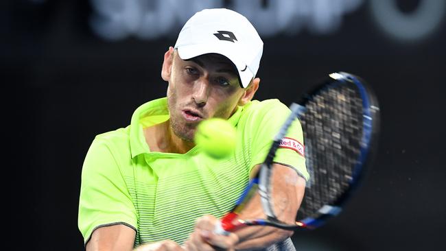 Australian John Millman returns during his first round match against Peter Polansky of Canada at the Brisbane International Tennis Tournament in Brisbane, Tuesday, January 2, 2018. (AAP Image/Dave Hunt) NO ARCHIVING, EDITORIAL USE ONLY