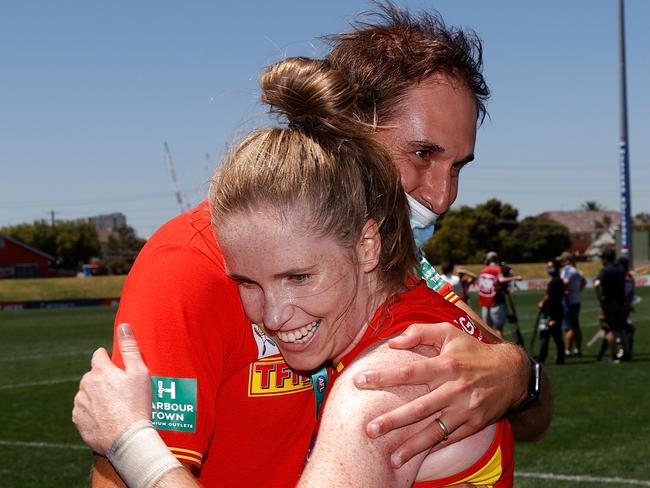 MELBOURNE, AUSTRALIA - JANUARY 16: Cameron Joyce and Tara Bohanna of the Suns celebrate during the 2022 AFLW Round 02 match between the West Coast Eagles and the Gold Coast Suns at VU Whitten Oval on January 16, 2022 in Melbourne, Australia. (Photo by Michael Willson/AFL Photos via Getty Images)