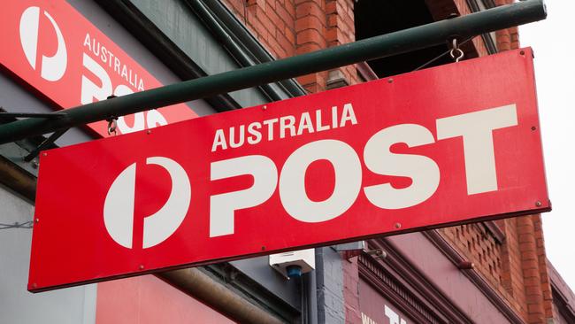 Melbourne, Australia - December 7, 2014: Australia Post is the national supplier of postal services in Australia. This is the Australia Post sign hanging outside a street front store in Hawthorn, Melbourne, Australia.