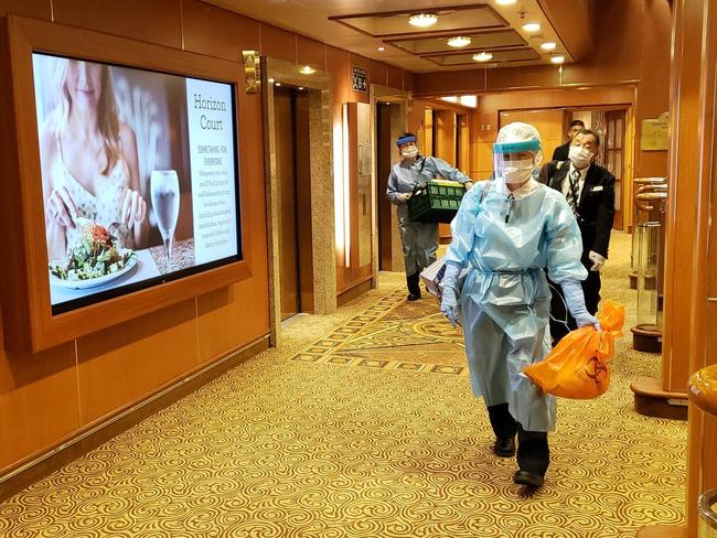 Medical workers on board the Diamond Princess, where people have tested positive for coronavirus. Picture: Twitter/@Mizikis