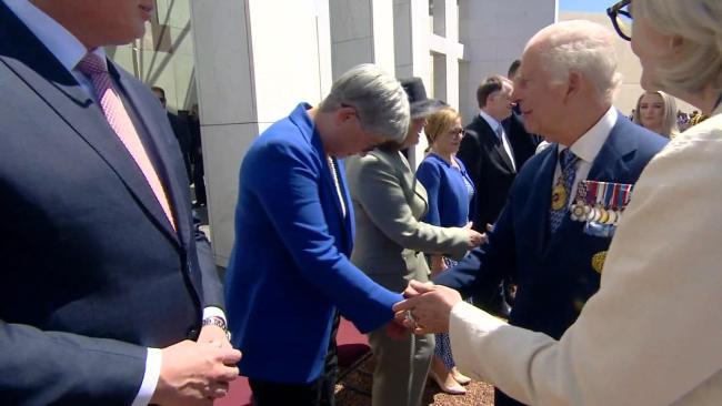 Foreign Minister Penny Wong bows as she greets King Charles outside Parliament House. Picture: Supplied