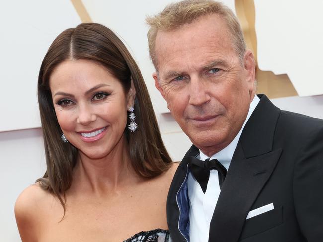 HOLLYWOOD, CALIFORNIA - MARCH 27: (L-R) Christine Baumgartner and Kevin Costner attend the 94th Annual Academy Awards at Hollywood and Highland on March 27, 2022 in Hollywood, California. (Photo by David Livingston/Getty Images)