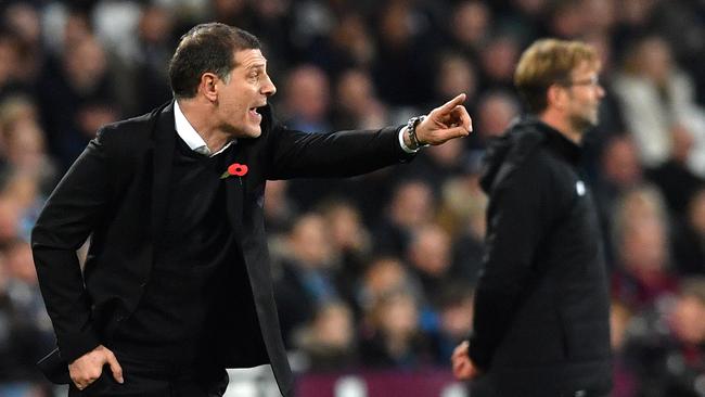 West Ham United's Croatian manager Slaven Bilic (L) and Jurgen Klopp.