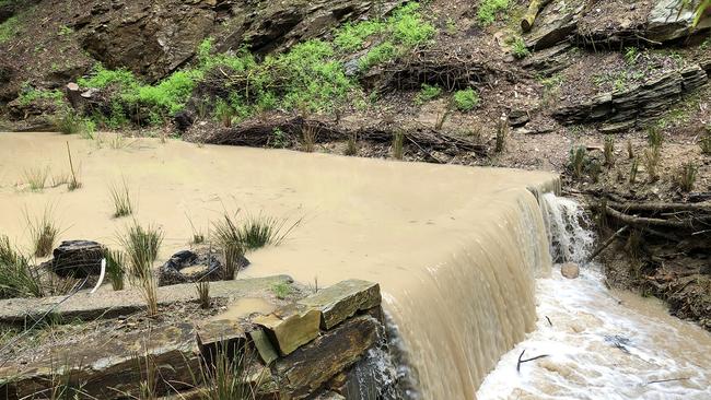 Third Creek. Brown creek water from the quarry, joining the clear water from Third Creek. Picture: Supplied.