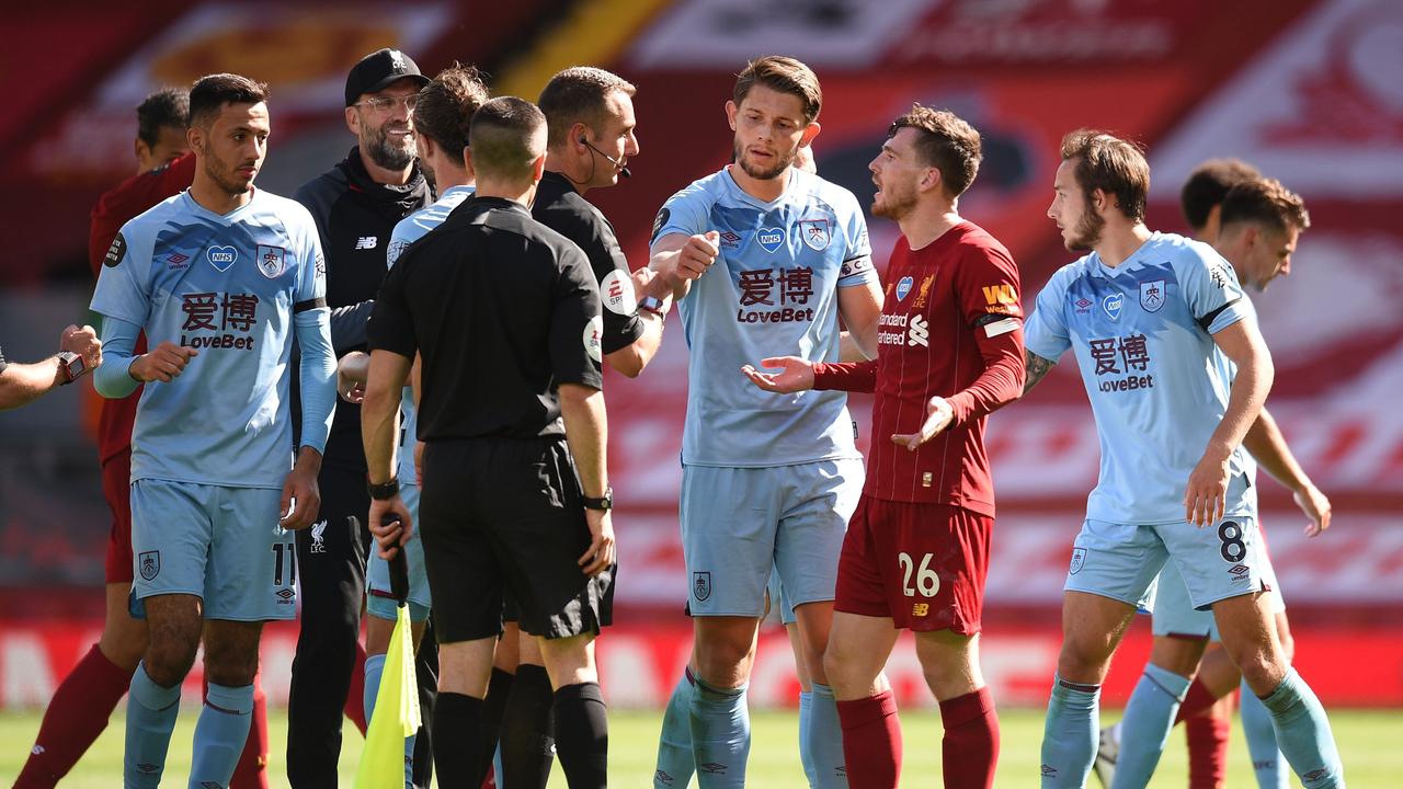 Andy Robertson speaks with Coote in 2020 in Liverpool. (Photo by Oli Scarff/Getty Images)