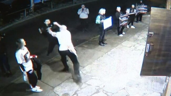 The chef lunges at man accompanying the protesters. Picture: 9 News