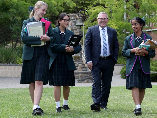 01/02/2018 Seymour College  Principal Kevin Tutt with students Maddie Habgood (16), Caitlin Duong (16) and Head Girl Anjana Prabu (17). Story is about private school fees. Fees at Seymour College (a girls school) have not risen this year because of a push for more efficient use of funds.Kelly Barnes/The Australian