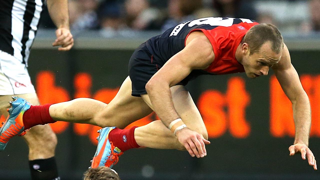 Round 12: Melbourne v Collingwood Picture : Wayne Ludbey AFLR1214 Daniel Cross over the top of Dayne Beams