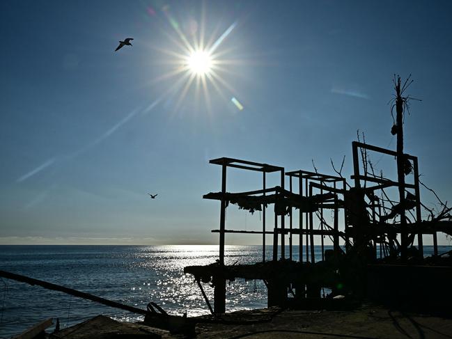 The frame of a building remains amid the rubble of burned-out homes in Malibu. Picture: AFP