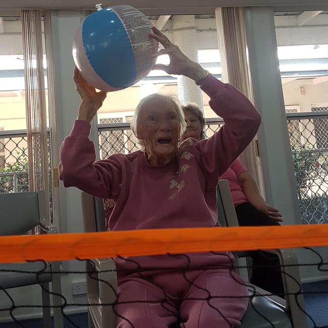 Linda Paddon, then 104, playing ‘beach volleyball’ at PM Village, Bald Hills.