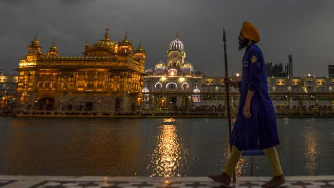 A sewadar (volunteer) at the Golden Temple in Amritsar. Picture: AFP