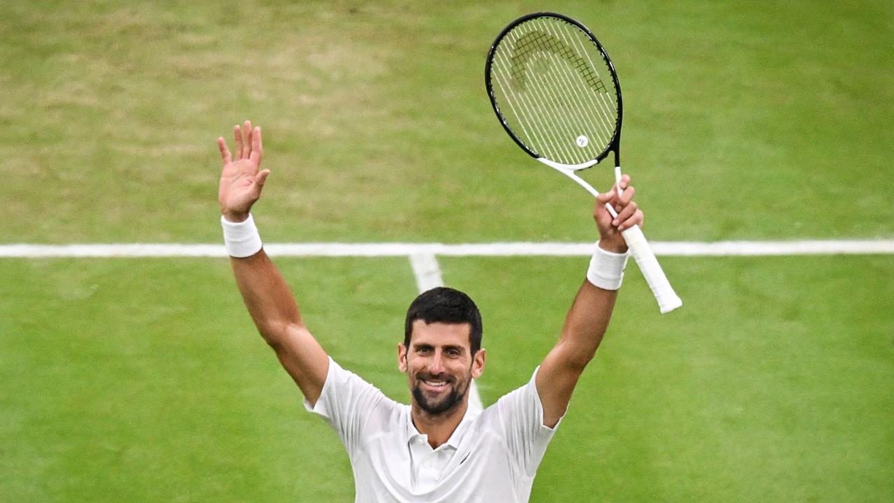 Novak Djokovic celebrates winning against Italy's Jannik Sinner during their men's singles semi-finals tennis at the 2023 Wimbledon Championships. (Photo by Glyn KIRK / AFP) /