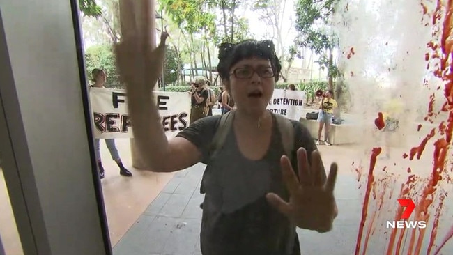 Refugee protesters have thrown red paint during his visit to the University of Queensland. Picture: 7NEWS