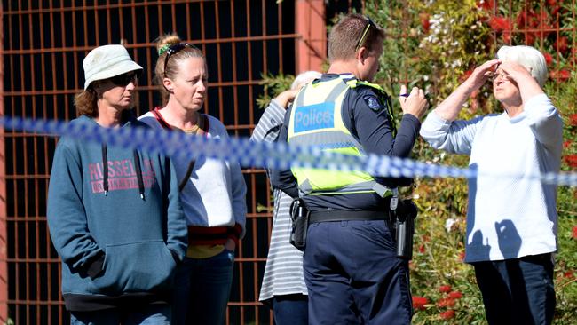 Police speaking to people outside of the Farmers Arms Hotel in Creswick, where a man was killed. Picture: Andrew Henshaw