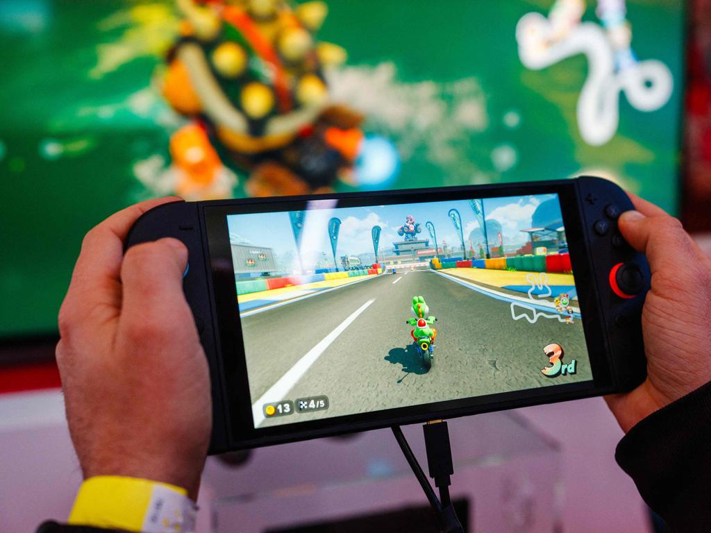A gamer plays Mariokart World with the new Nintendo Switch 2 video-game console system. Nintendo announced it would delay its release in the wake of Donald Trump’s tariffs. Picture: AFP