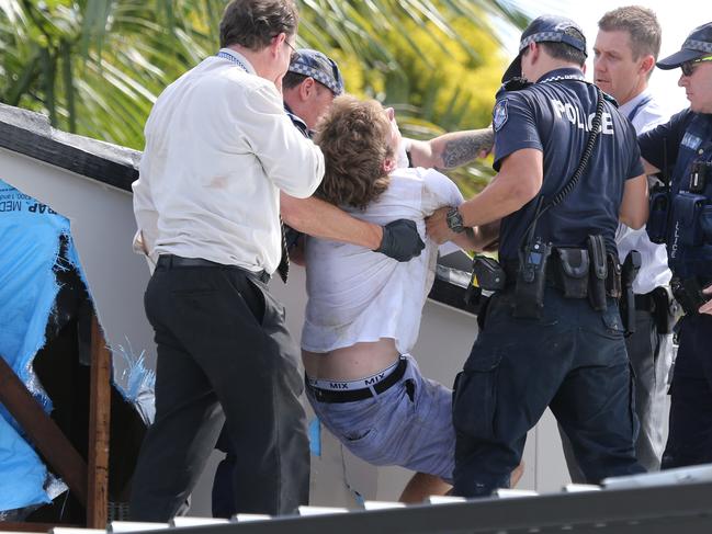 Police arrest a man in a roof on Coogeen St Sorrento after a massive manhunt involving dozens of officers and the dog squad in the area. Picture Glenn Hampson