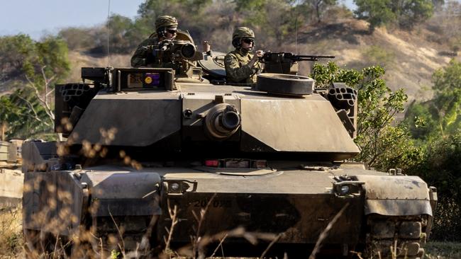 Australian Army soldiers from the 1st Armoured Regiment conduct manoeuvre training on an M1A1 Abrams Main Battle Tank in Puslatpur, Indonesia during Exercise Super Garuda Shield 2023. *** Local Caption *** At the invitation of Indonesian Armed Forces (TNI), Australia is contributing over 125 personnel from the Australian Defence Force (ADF) to Exercise Super Garuda Shield 2023 (SGS23). SGS23 is an TNI and United States Indo Pacific Command led bilateral training activity. It is focused on joint operations with international partners in and around East Java in Indonesia from 31 August to 13 September. Held since 2009, the ADF first participated in 2022, and in 2023 is contributing an Australian Army force element including a Troop of M1A1 Abrams tanks from the 1st Armoured Regiment.  The contingent also includes an Infantry Platoon from the 10th/27th Battalion, Royal South Australian Regiment, command and control elements, and a range of armoured vehicles, trucks and recovery vehicles.