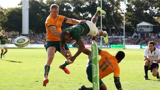 Marika Koroibete (right) lays a bone-crunching tackle on Makazole Mapimpi. Picture: Mark Kolbe/Getty Images