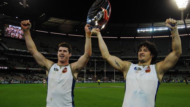 Footballers Jonathan Brown and Brendan Fevola with the trophy after the Hall Of Fame Tribute Match, Victoria vs Dream Team at the MCG 10 May 2008.