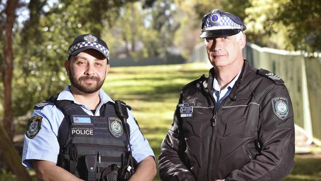 Senior Constable Islam Omar and Senior Sergeant David Chandler helped to save the lives of two burns victims. Picture: Flavio Brancaleone