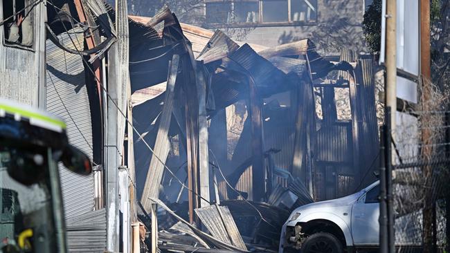 Fire crews clean up after an overnight factory fire in Pentex Street, Salisbury. Picture: Lyndon Mechielsen/Courier Mail