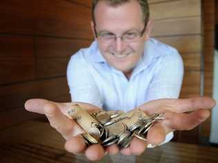 Brad Fitzgibbon with 5 cent pieces. Photo: Bev Lacey/The Chronicle. Picture: Bev Lacey