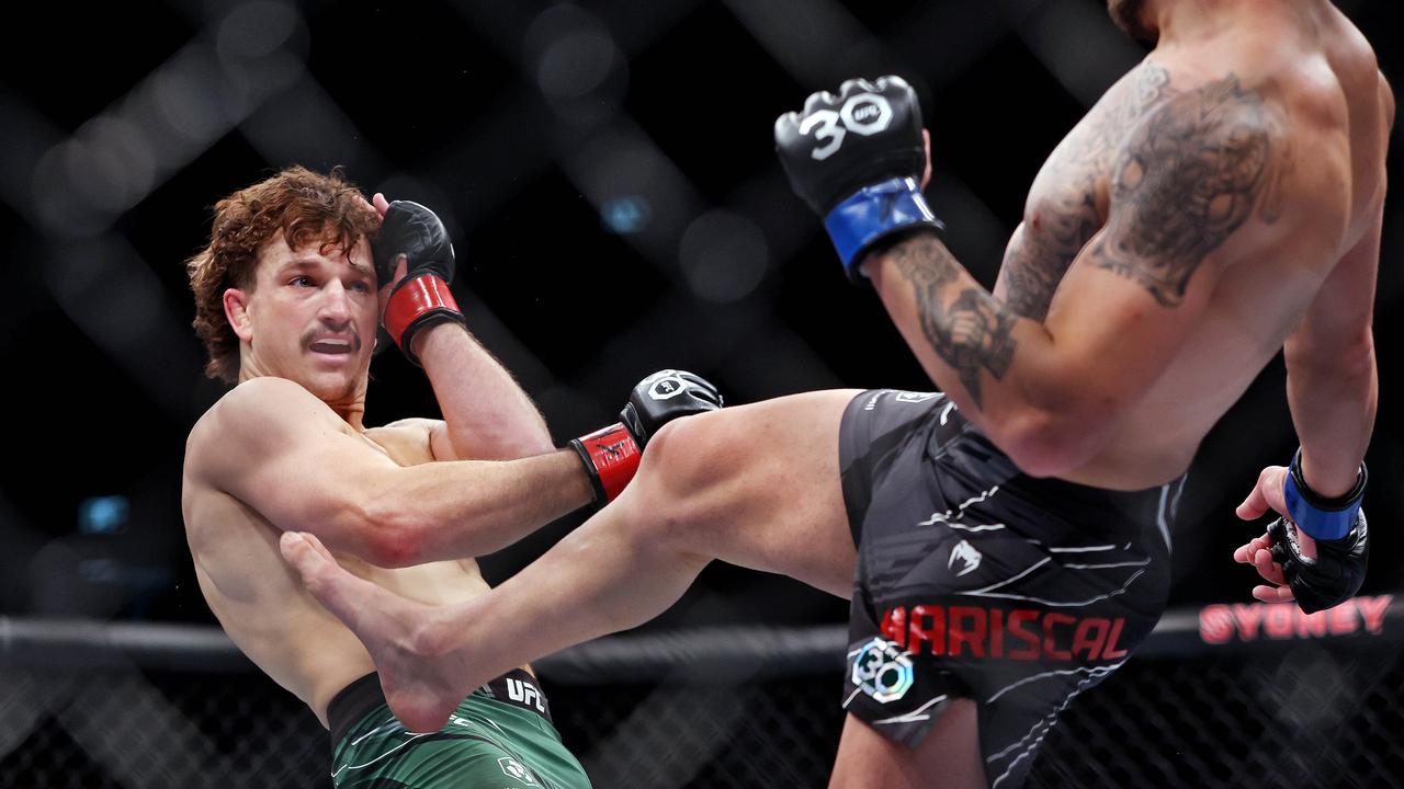 Jack Jenkins (left) evades a kick from Chepe Mariscal at UFC 293 in Sydney in September last year. Picture: Sam Ruttyn