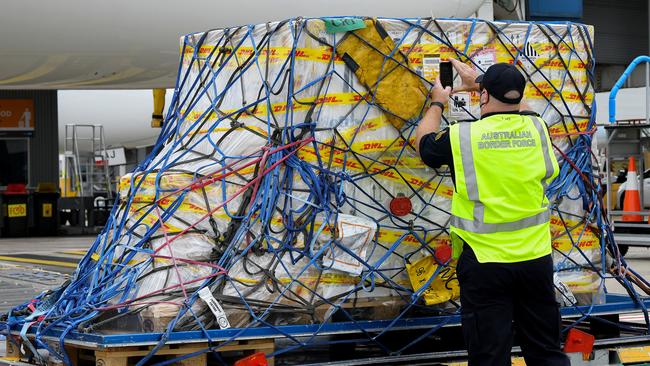 The first Australian shipment of Pfizer COVID-19 vaccines on the tarmac of Sydney Airport on Monday. Picture: AAP Image/Pool/Bianca De Marchi