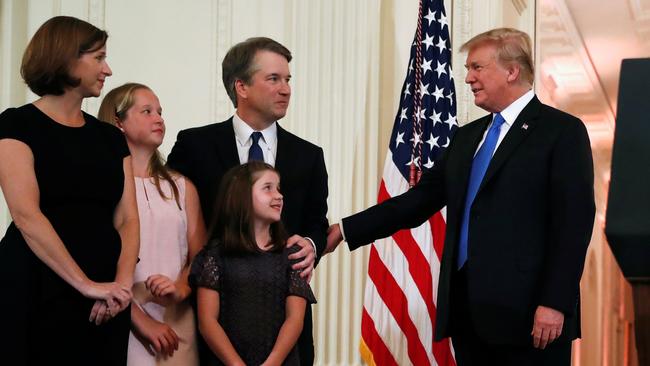 U.S. President Donald Trump talks to Supreme Court nominee judge Brett Kavanaugh, his daughters and his wife Ashley Estes Kavanaugh, in the East Room of the White House in Washington, U.S., July 9, 2018. REUTERS/Leah Millis - RC1B13DCF6E0