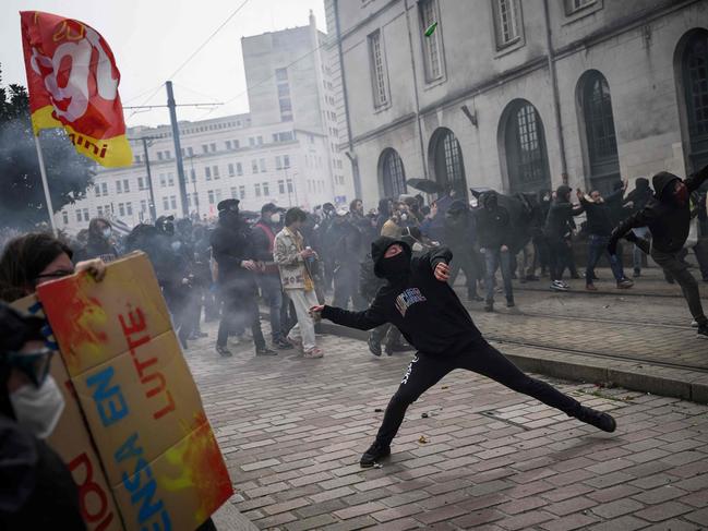 Protestors clash with anti-riot police officers during a rally on a nationwide action day in Nantes, western France. Picture: AFP