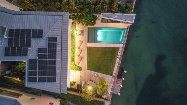 A property at 82 New Beach Road, in Sydney's Darling Point which has solar panels and a Tesla battery wall.