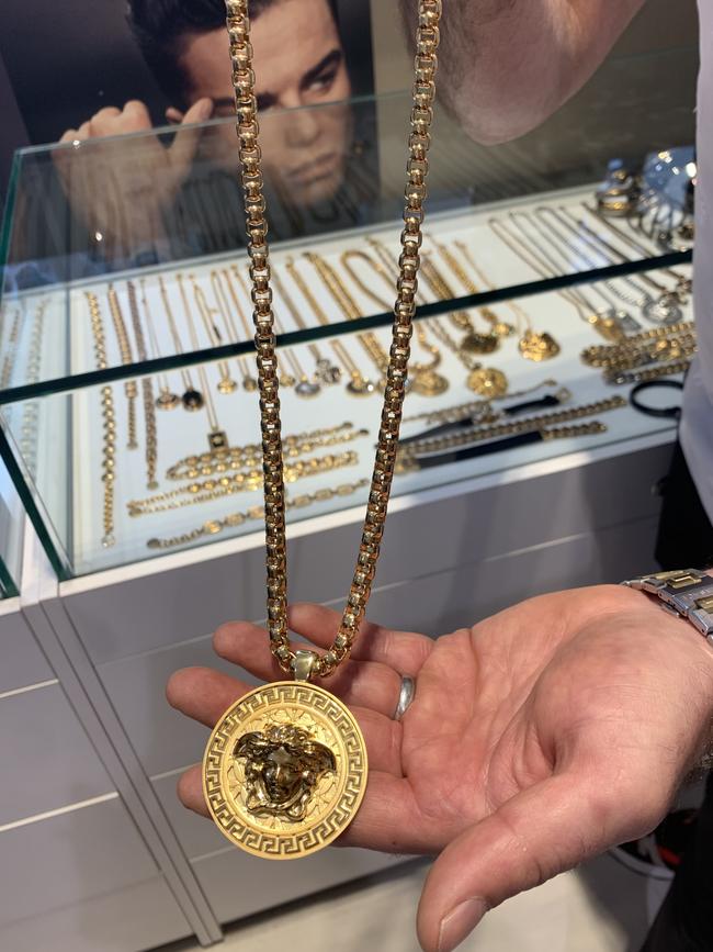 Disappointed Le Style shop owner Steven Adigrati models the type of Versace necklace which was stolen in the alleged fishing rod heist.