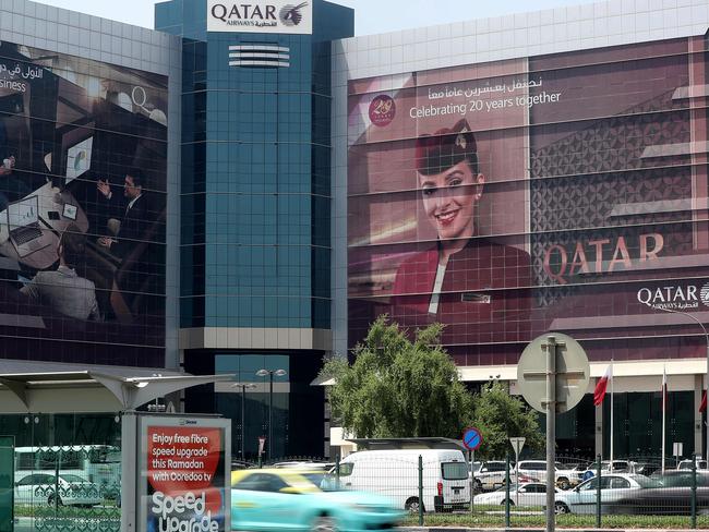 Cars drive past the Qatar Airways office in Doha following a ban on Qatari flights imposed by Saudi Arabia and its allies. Picture: AFP