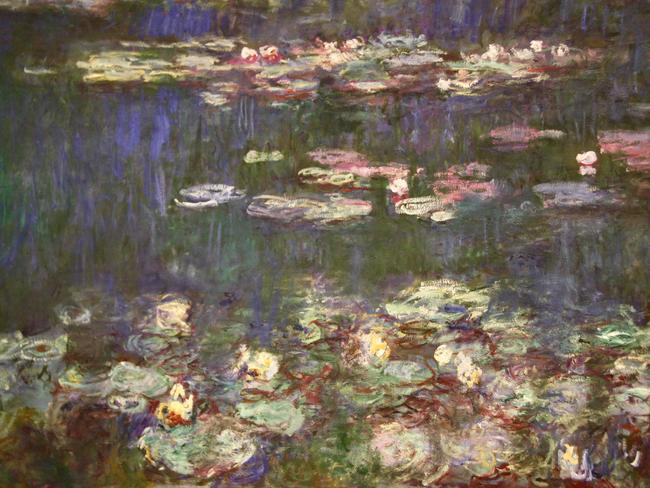 Closeup photo of a section of the Impressionist painter Claude Monetâs Waterlily paintings in the Musee de lâOrangerie in Paris