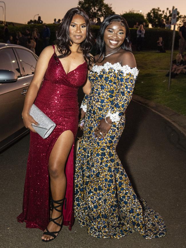 Bendam Nugai (left) and Asaku Kimba arrive at Harristown State High School formal at Highfields Cultural Centre, Friday, November 18, 2022. Picture: Kevin Farmer