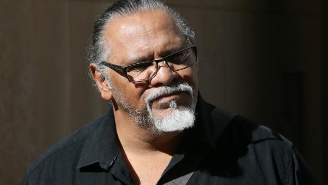 Aboriginal campaigner Adrian Burragubba leaves the Federal Court where he fought unsuccessfully to stop Adani’s mine. Picture: AAP Image/Richard Waugh