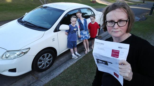 Carly Been and children Ed (6), Holly (7) and Will (6) with the family car. Picture: Glenn Hampson.