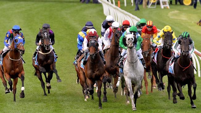 Fiorente (second from left) is caught wide in the Cox Plate but produces a gutsy run to finish third to Shamus Award (right). Pi