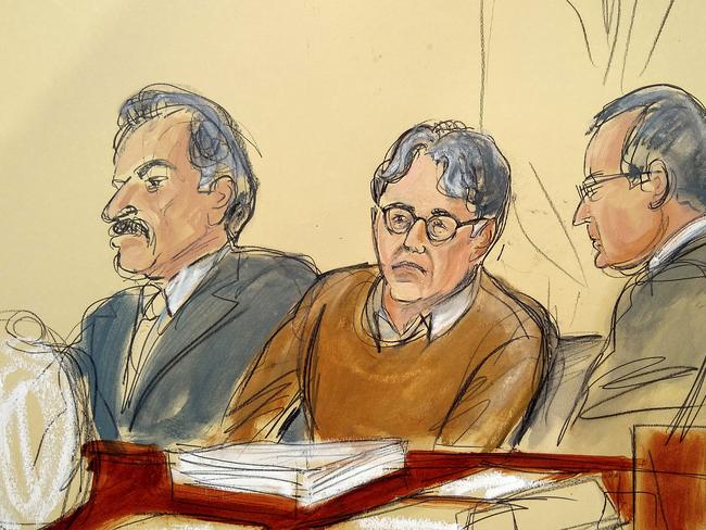 Defendant Keith Raniere, centre, leader of the secretive group NXIVM, is seated between his attorneys Paul DerOhannesian, left, and Marc Agnifilo during the first day of his sex trafficking trial. Picture: Elizabeth Williams