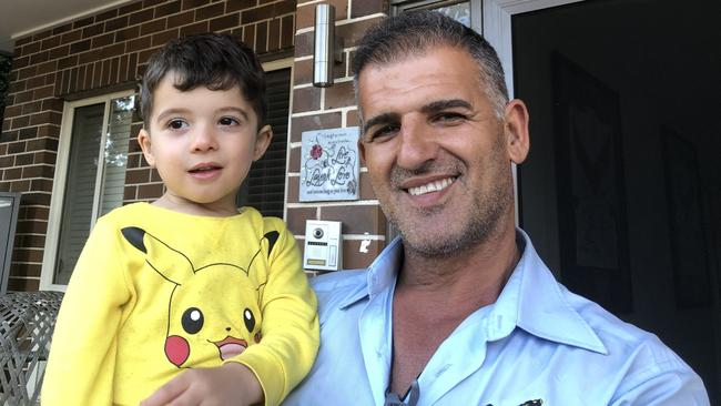 George Ishac with his son Noah at their Westmead home.